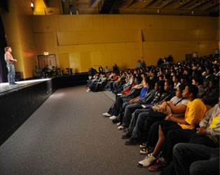 Photo of Michael Davie speaking in front of an audience